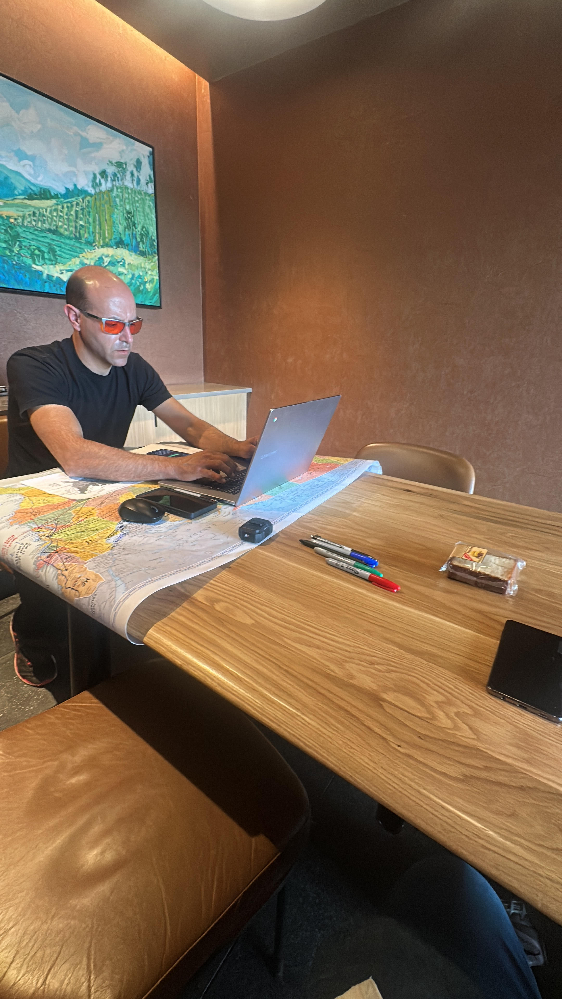 David Mor planning logistics over a map